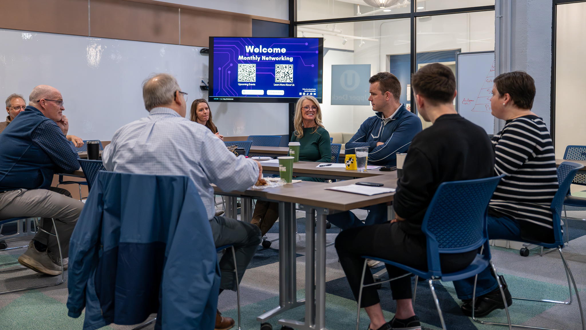 Attendees at a monthly networking meeting at The Hub