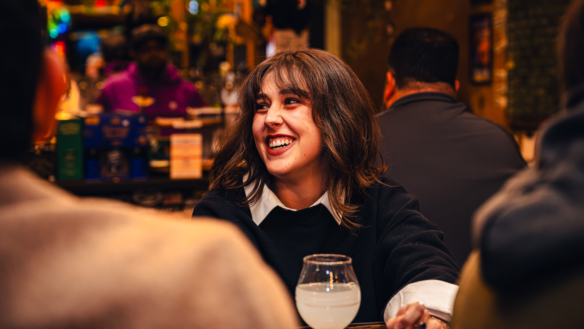Guest laughing and connecting at a quantum foam studios Revenue Multiplier event